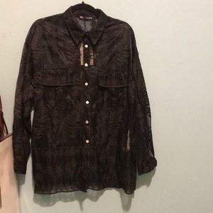 Embroidered sheer shirt.